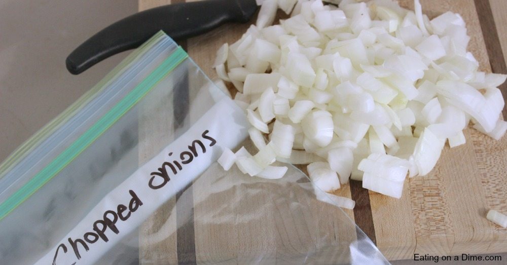 Close up image of chopped onions and a freezer bag. 