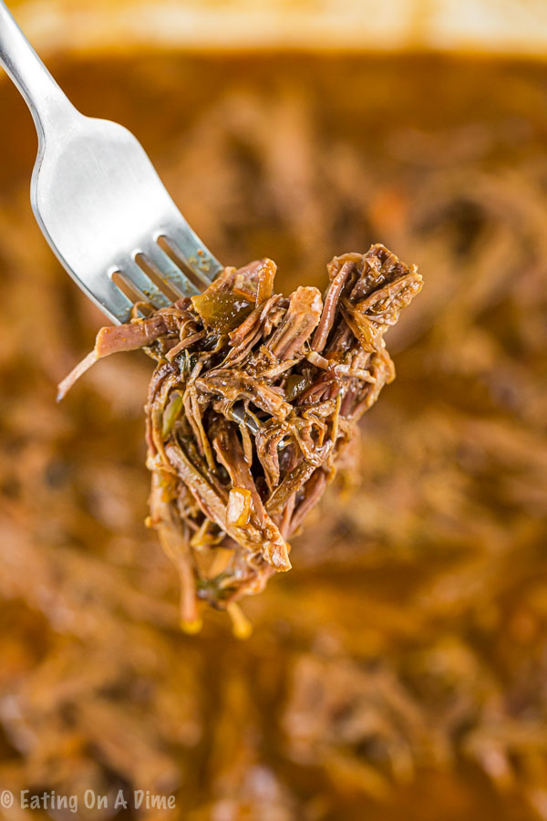 Enjoy Crock pot shredded beef tacos loaded with tender beef. The slow cooker does all of the work and all you need to do is add your favorite toppings! 