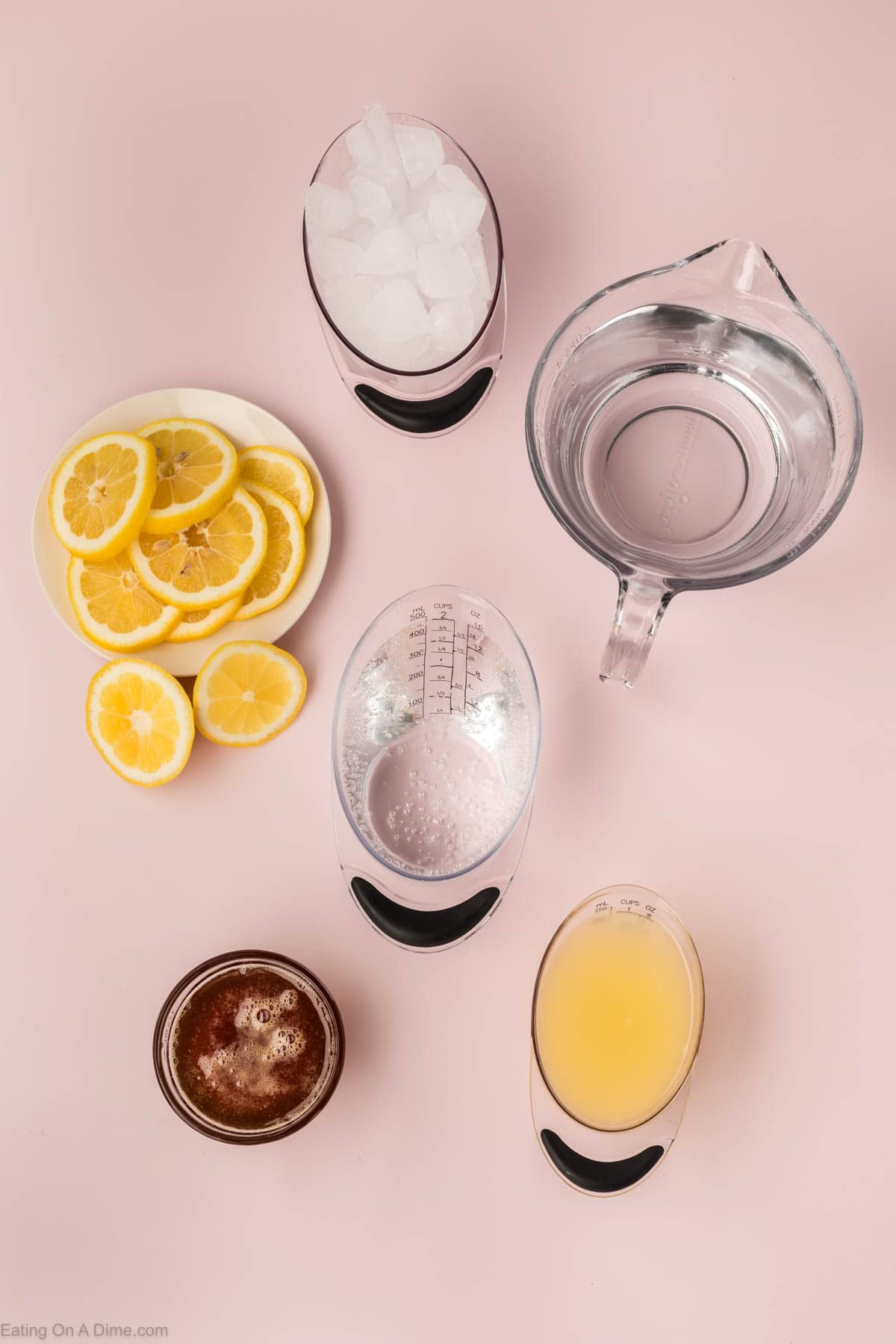 Ingredients - ice, lemon slices, water, club soda, honey, and fresh lemon juice