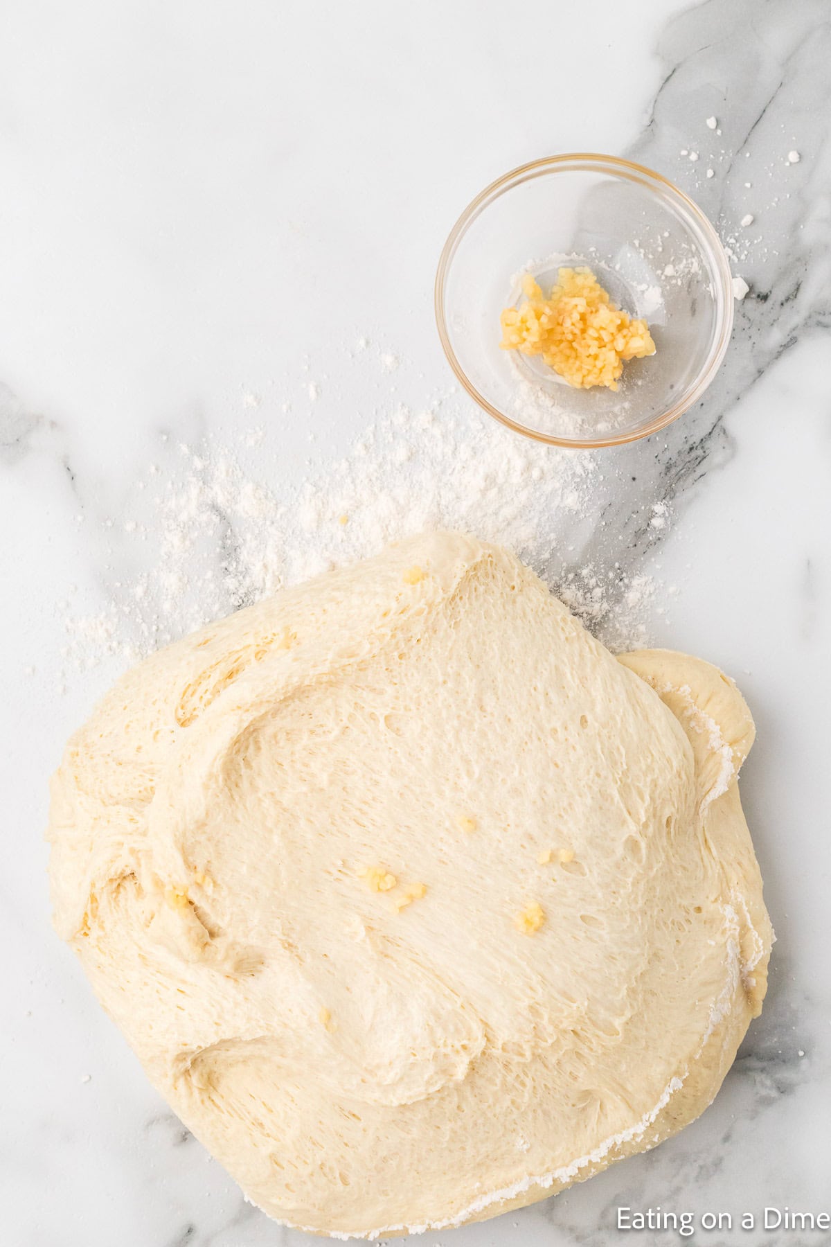 Naan Dough topped with minced garlic