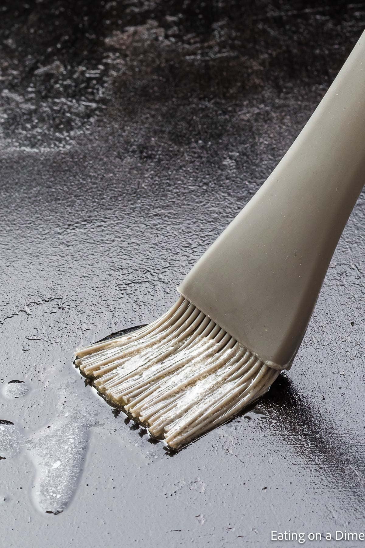 Brushing butter on the griddle