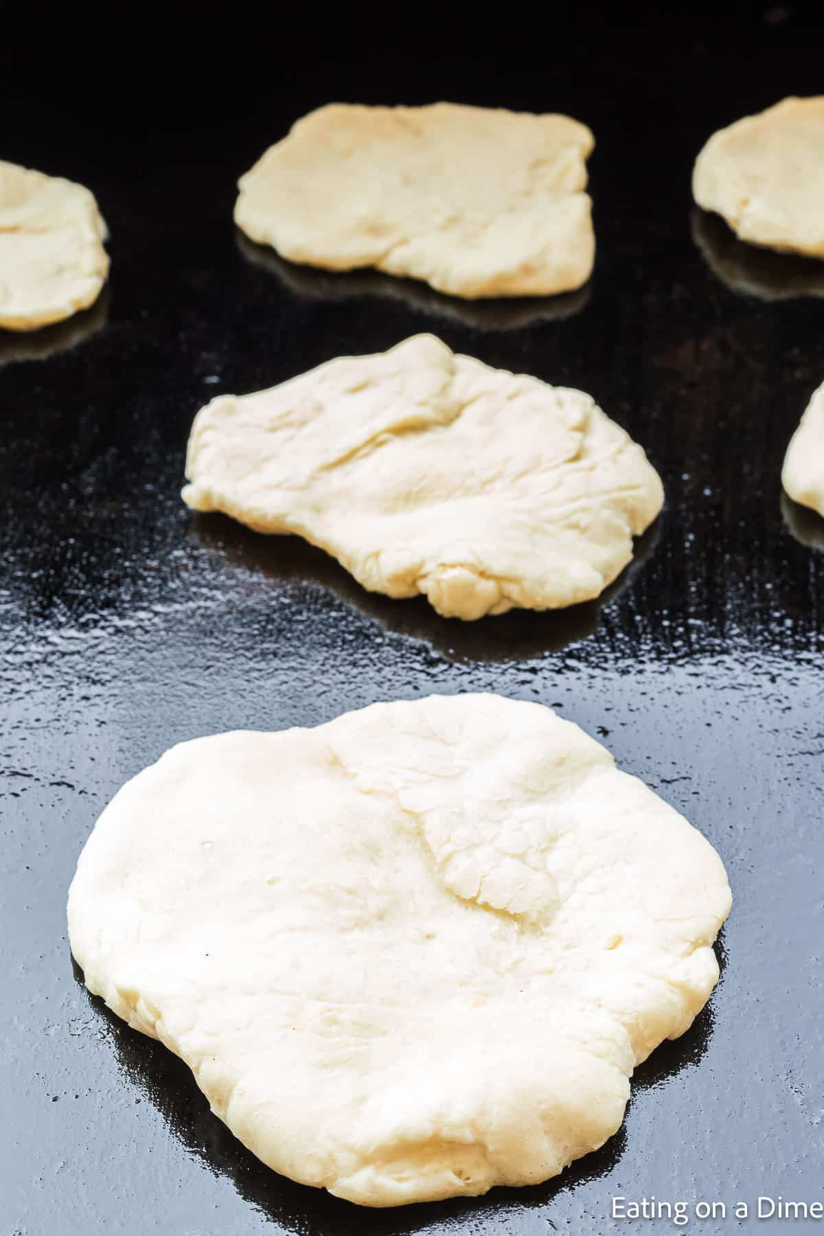 Placing dough on the grill