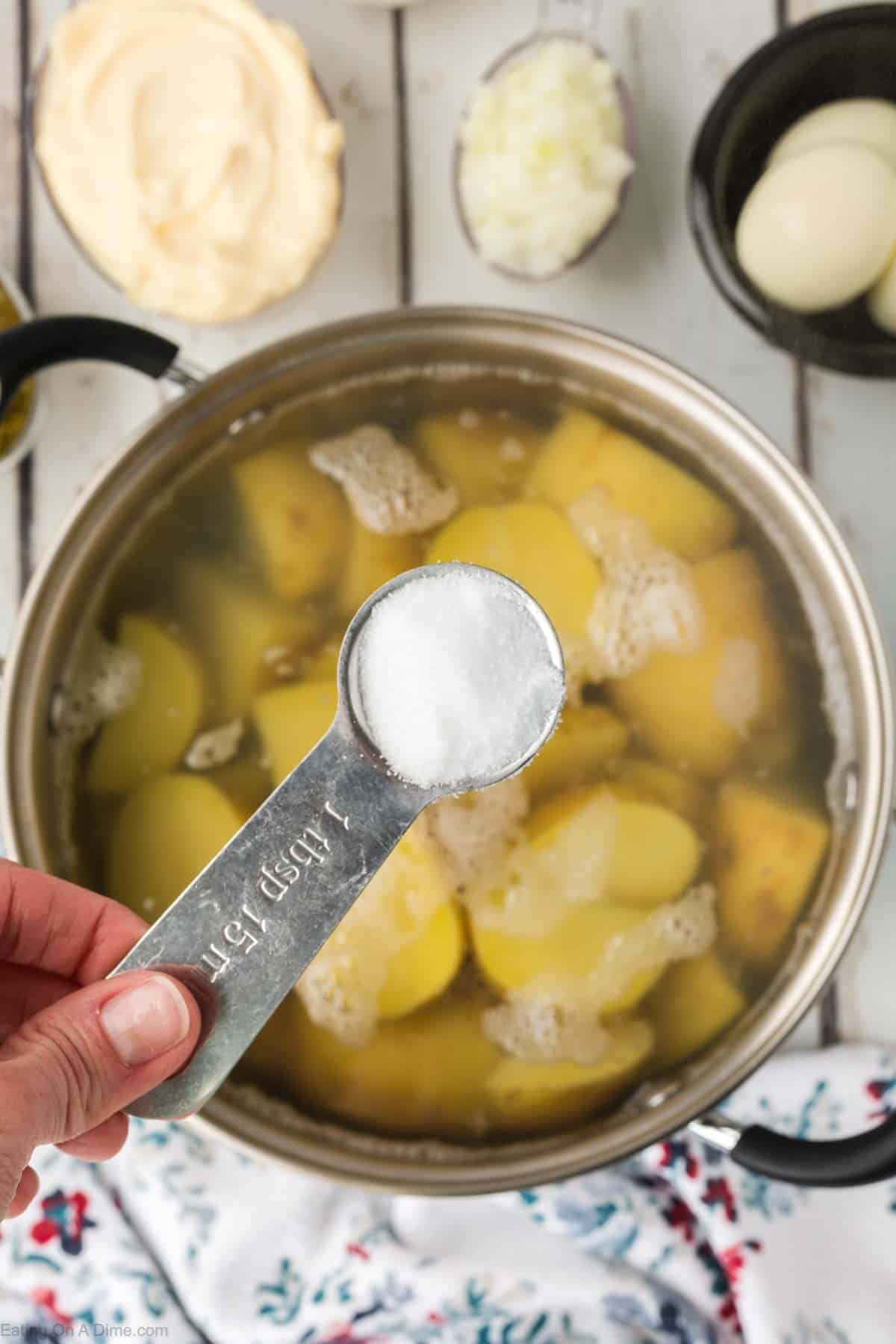 Tablespoon of salt with the large pot of potatoes in water