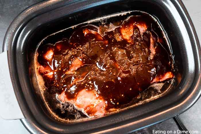 Crock Pot Dr Pepper Ribs has the perfect amount of flavor and the meat is tender from being slow cooked all day. You won't believe how easy this crock pot dr pepper ribs recipe is. The combination of dr. pepper and BBQ sauce in the slow cooker with ribs makes this a delicious dinner idea. Ribs with dr pepper crock pot recipe makes dinner so easy. #eatingonadime #crockpotdrpepperribs