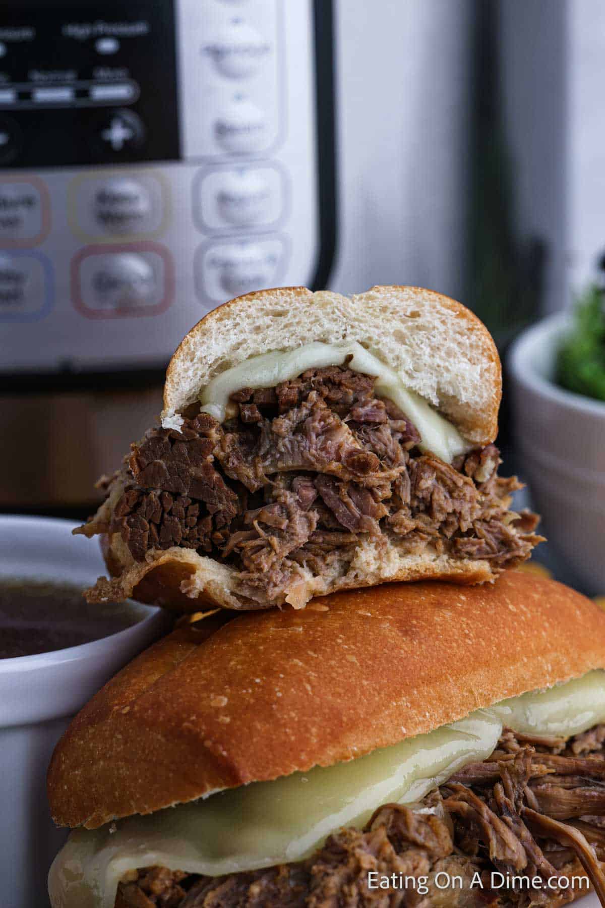 French Dip Sandwiches stacked on a plate