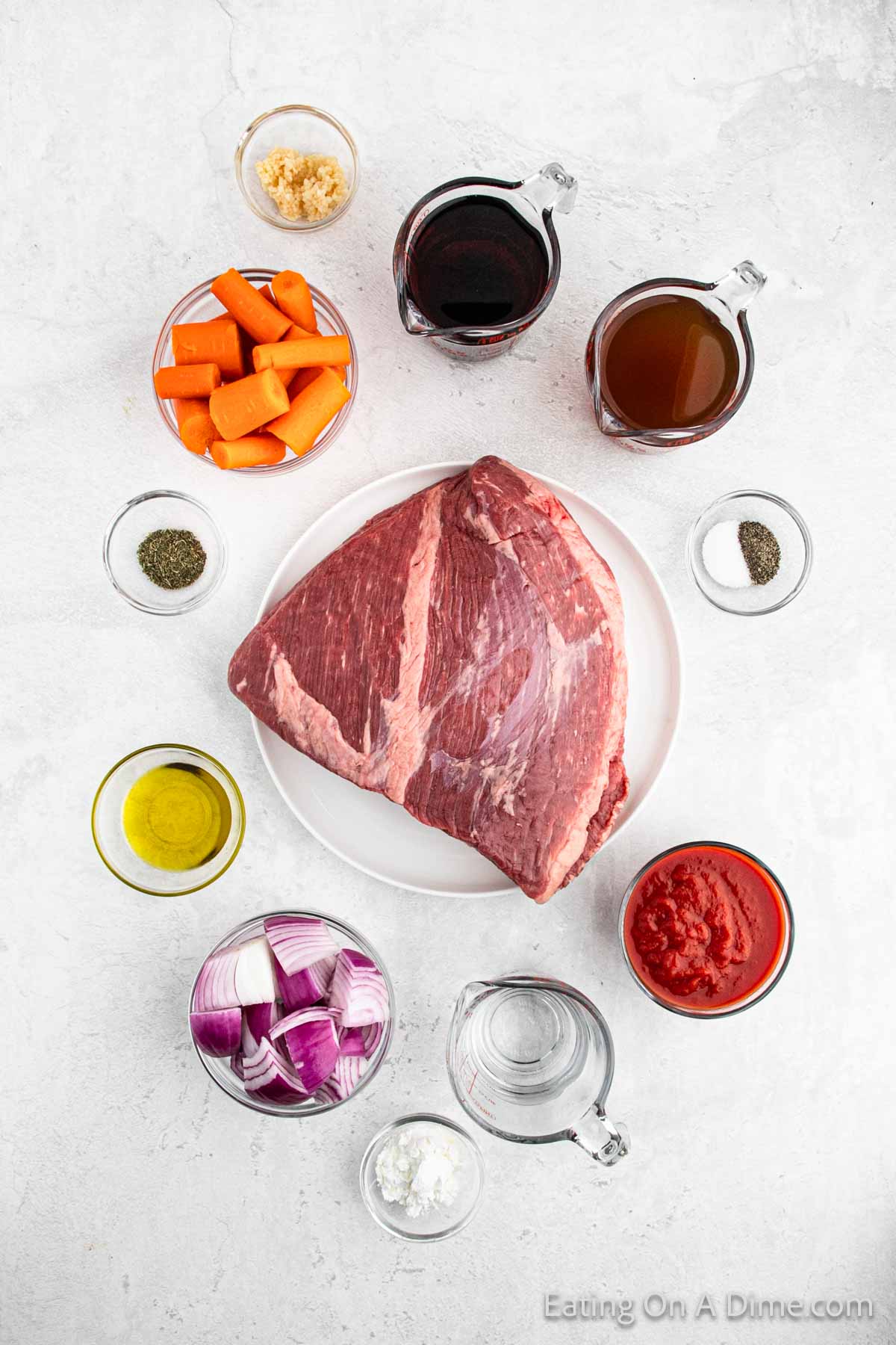 Ingredients - beef brisket, olive oil, carrots, red onion, salt, pepper, thyme, garlic, tomato sauce, beef broth, red wine, cornstarch, water