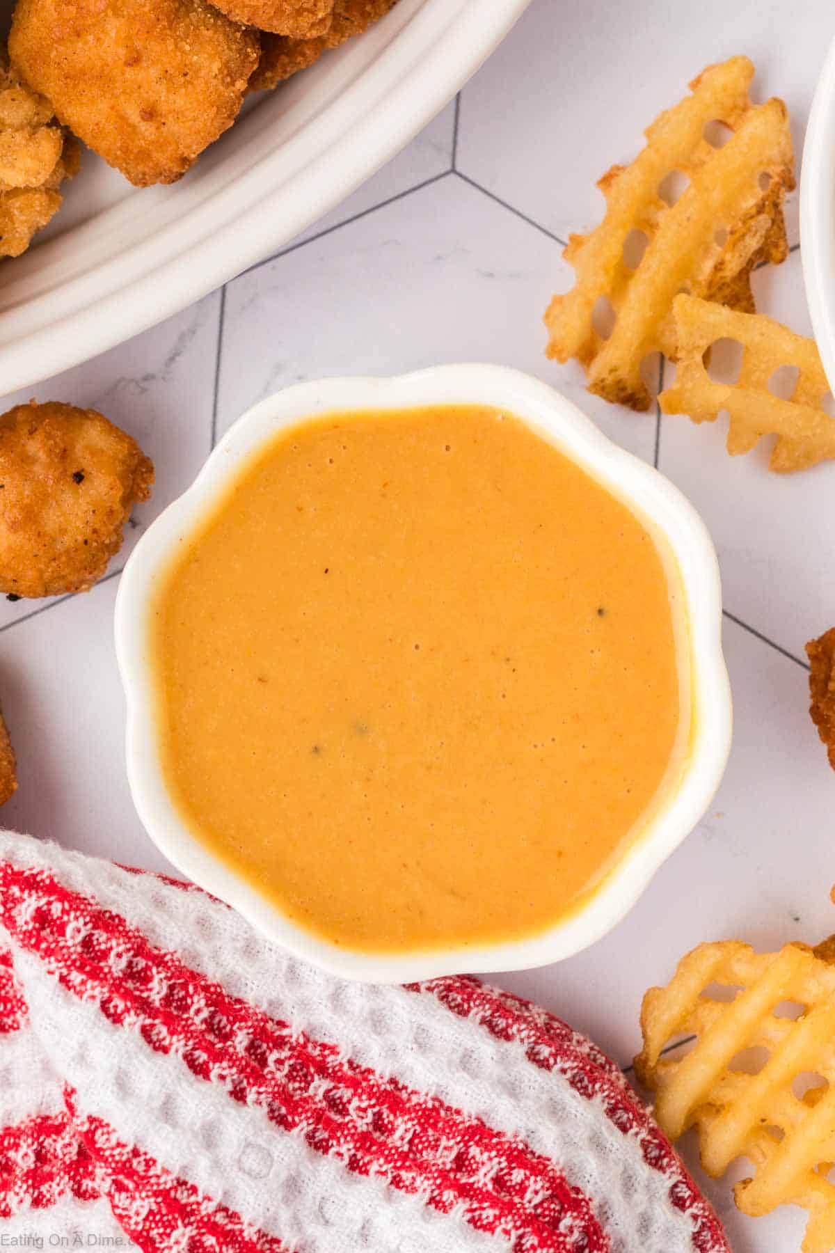 Chick Fil A Sauce in a bowl with a side of French Fries
