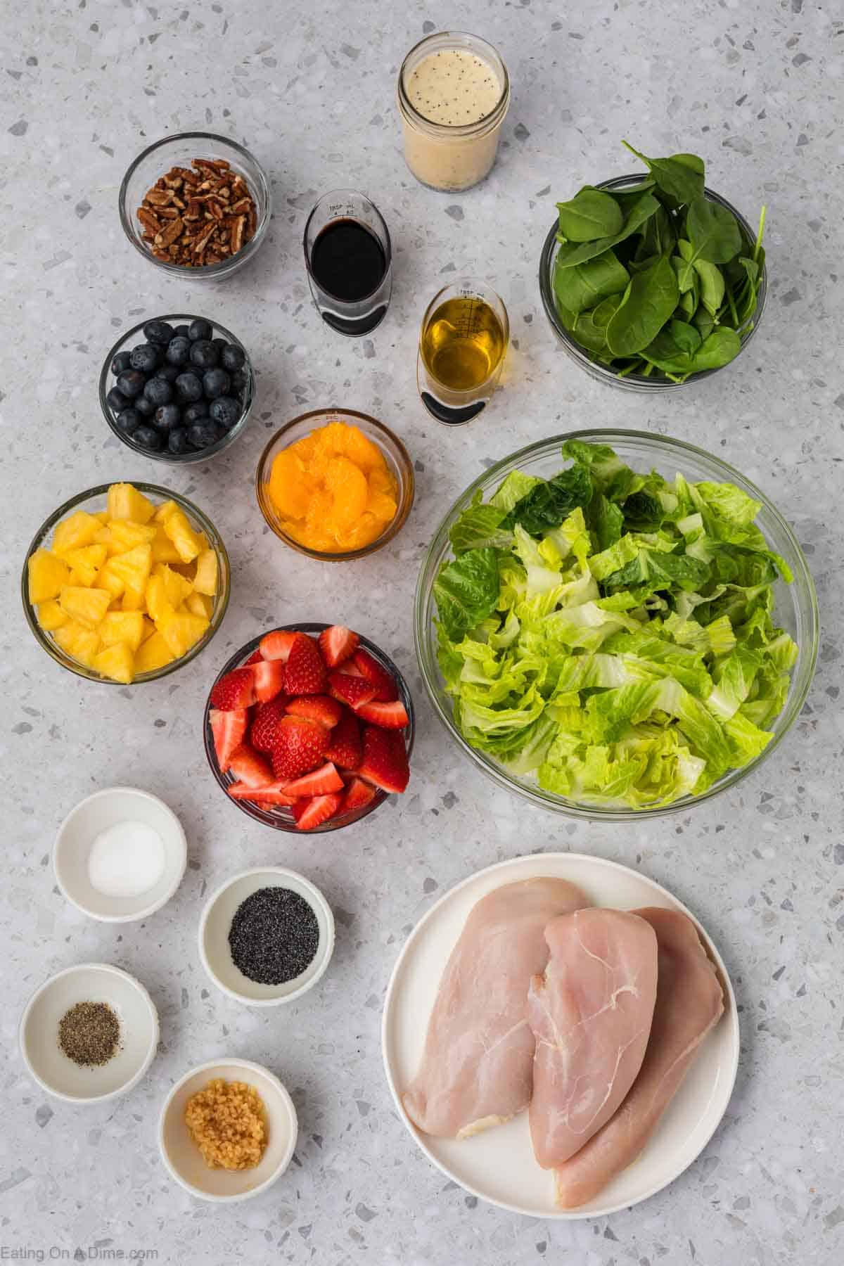 Ingredients - Romaine Hearts, spinach, pineapple, strawberries, blueberries, mandarin oranges, roasted pecans, mayonnaise, honey, apple cider vinegar, poppy seeds, milk, salt