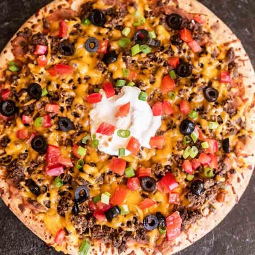 https://www.eatingonadime.com/wp-content/uploads/2020/07/taco-pizza-8-square-500x500.jpg