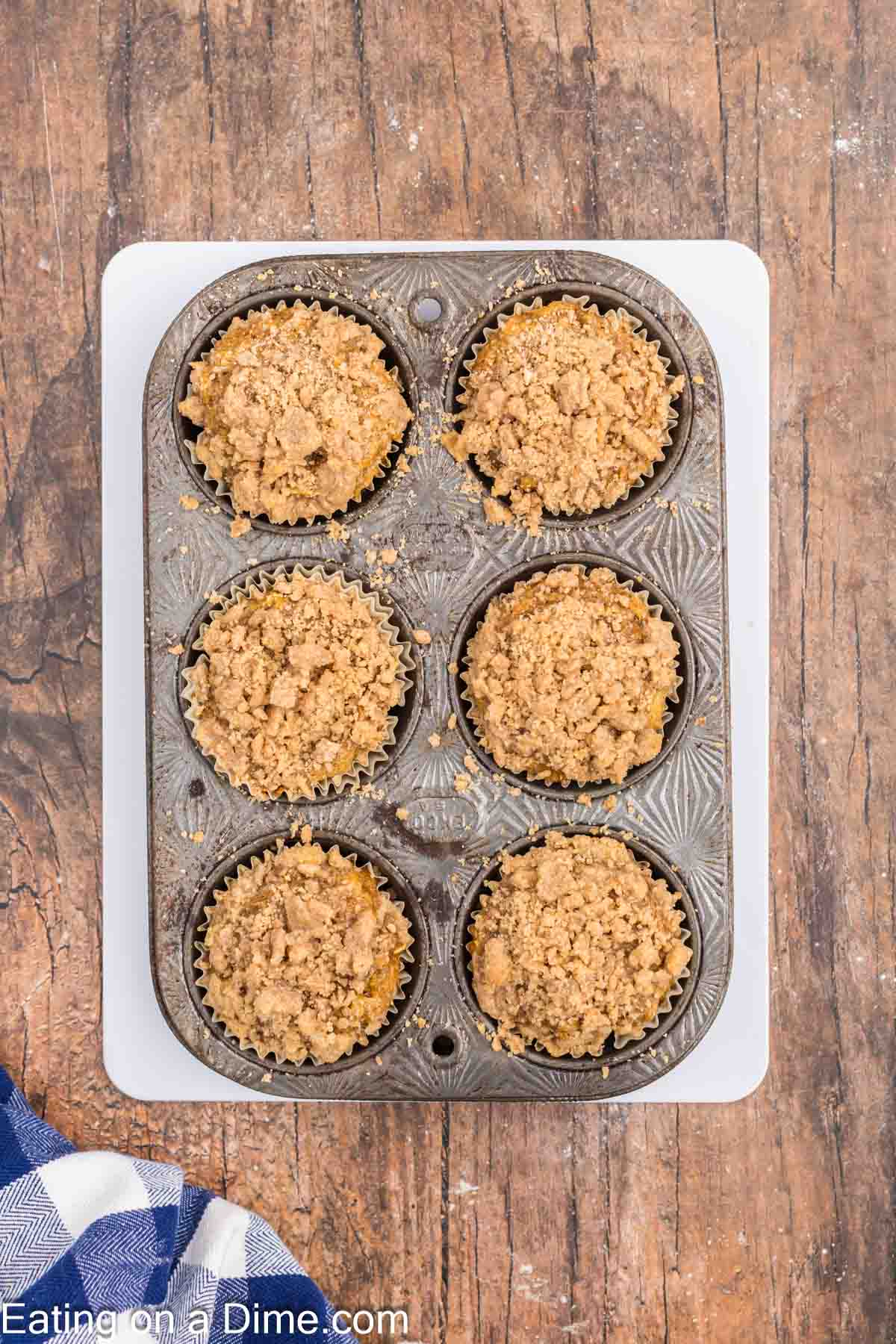 Baked pumpkin muffins in a muffin tin