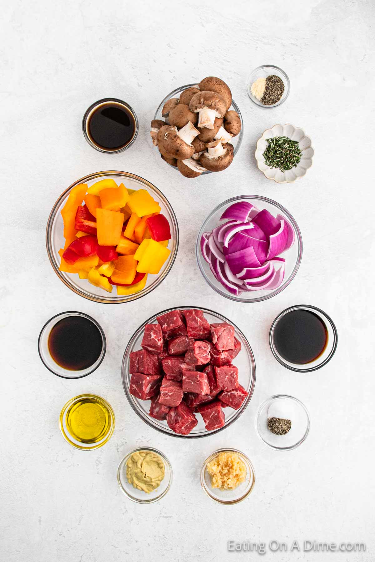Ingredients - balsamic vinegar, soy sauce, worcestershire sauce, olive oil, rosemary, dijon mustard, pepper, onion powder, beef sirloin, mushrooms, bell peppers, red onion, 