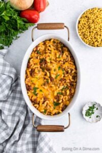 Hamburger casserole in a baking dish topped with melted cheese