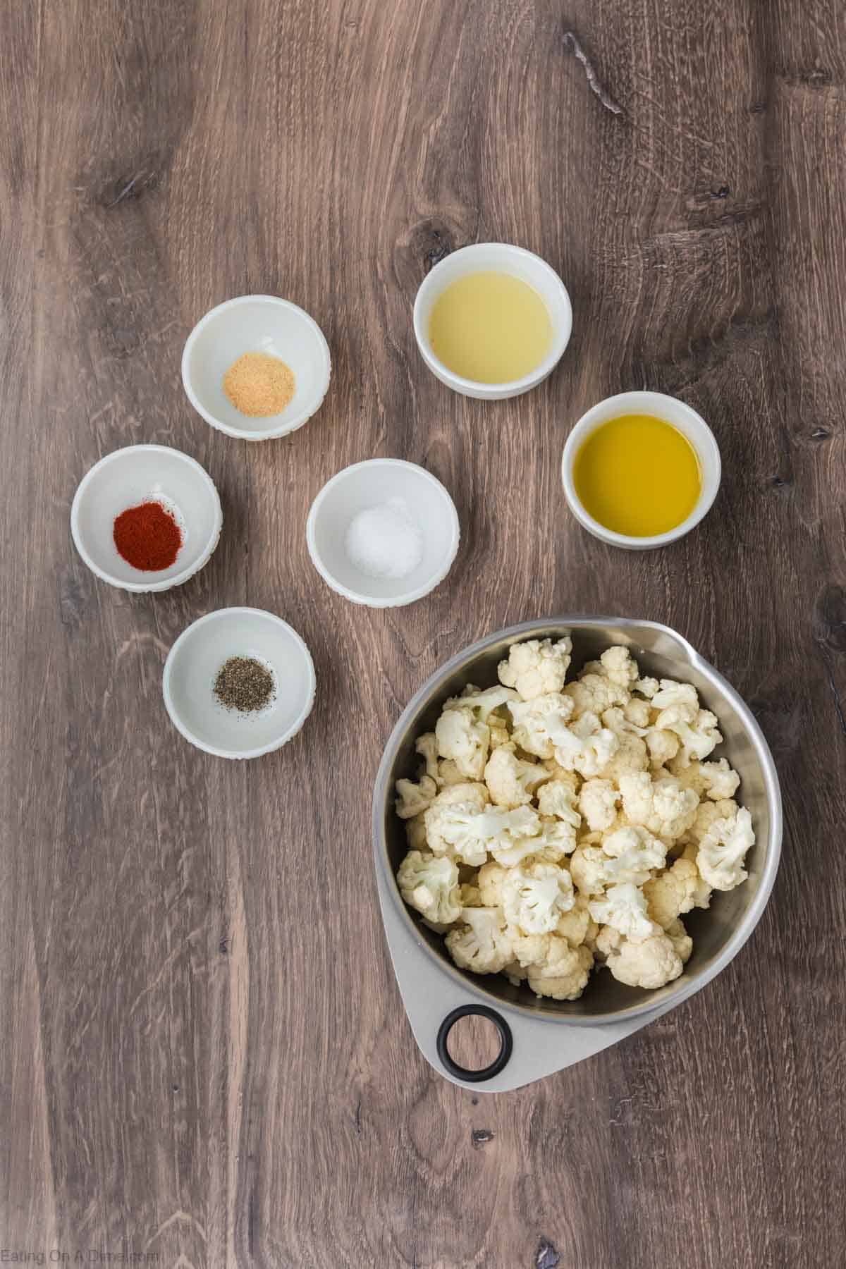 Ingredients - head of cauliflower, olive oil, lemon, smoked paprika, garlic powder, salt, pepper