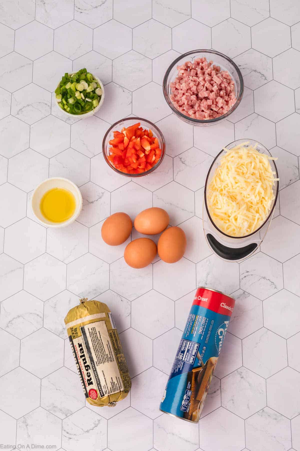 Ingredients - Pizza Dough, mozzarella cheese, olive oil, eggs, sausage, red bell pepper