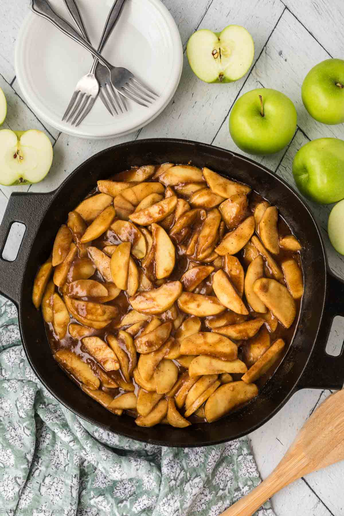 Slice Fried Apples in a Cast Iron Skillet