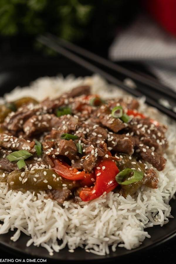 Need an easy crock pot recipe? This Crockpot Pepper Steak Recipe is delicious! Easy to make slow cooker pepper steak recipe is simple to make. The entire family will loved this Chinese pepper steak recipe made in the crock pot! #eatingonadime #peppersteak #chineserecipes #crockpotrecipes #slowcookerrecipes   