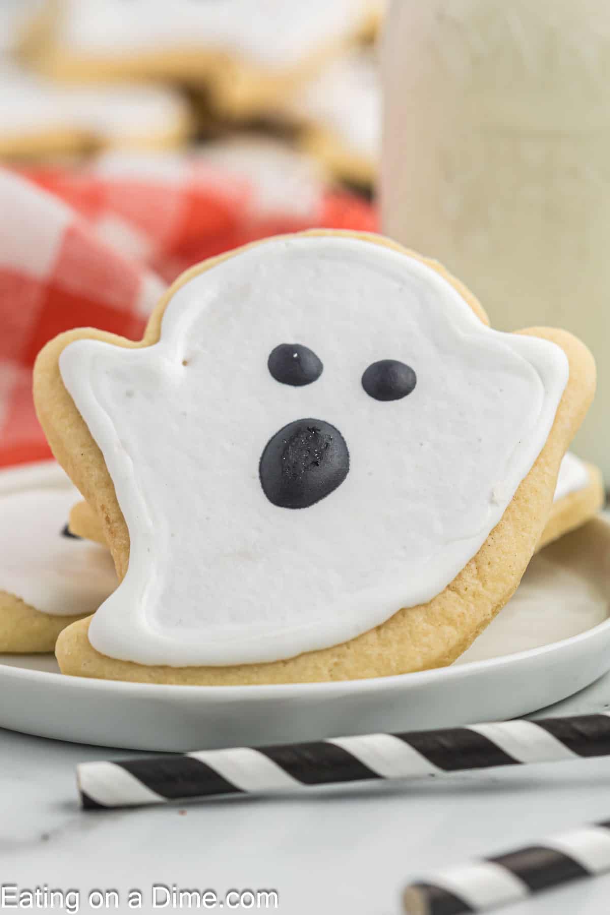 Ghost Cookies stacked on a plate