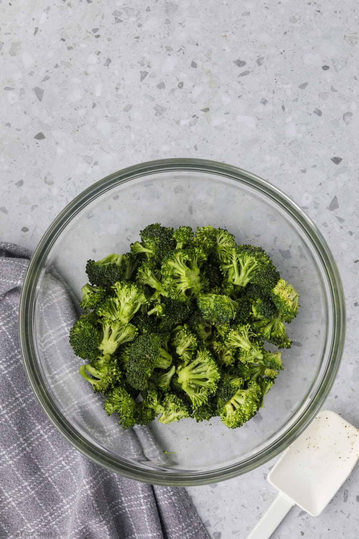 Chopped broccoli in a glass bowl