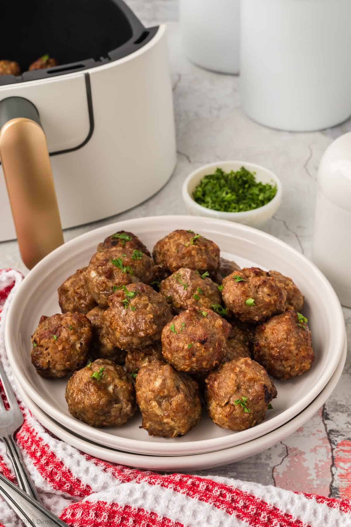 Cooked meatballs stacked on a plate