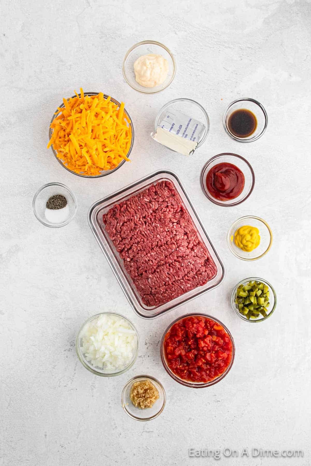 Ingredients - Ground Beef, onion, garlic, cream cheese, diced tomatoes, ketchup, mayonnaise, yellow mustard, Worcestershire Sauce, dill pickles, salt, pepper, cheese