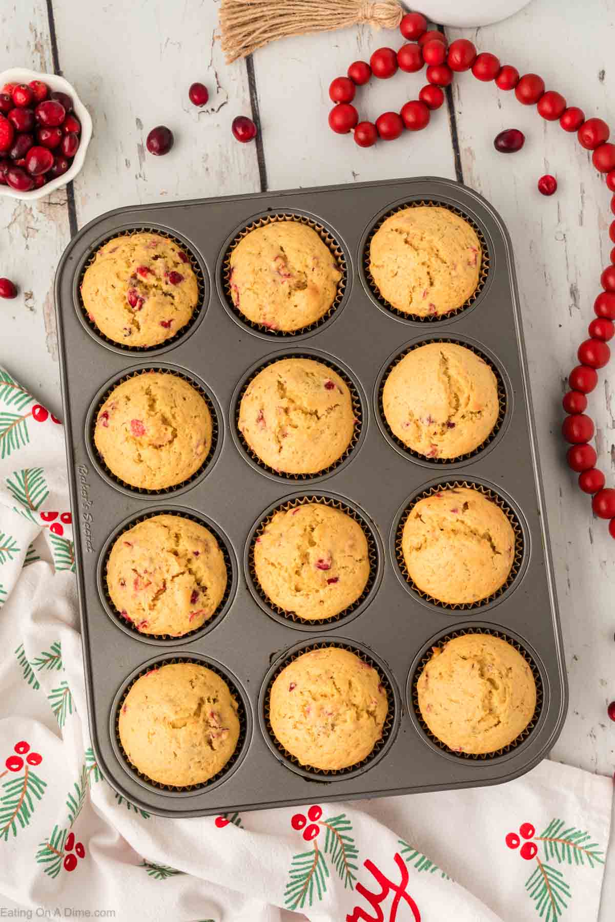Baked cranberry muffins in a muffin tin