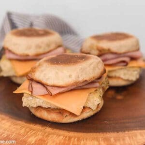 Three Breakfast Sandwiches on wood block