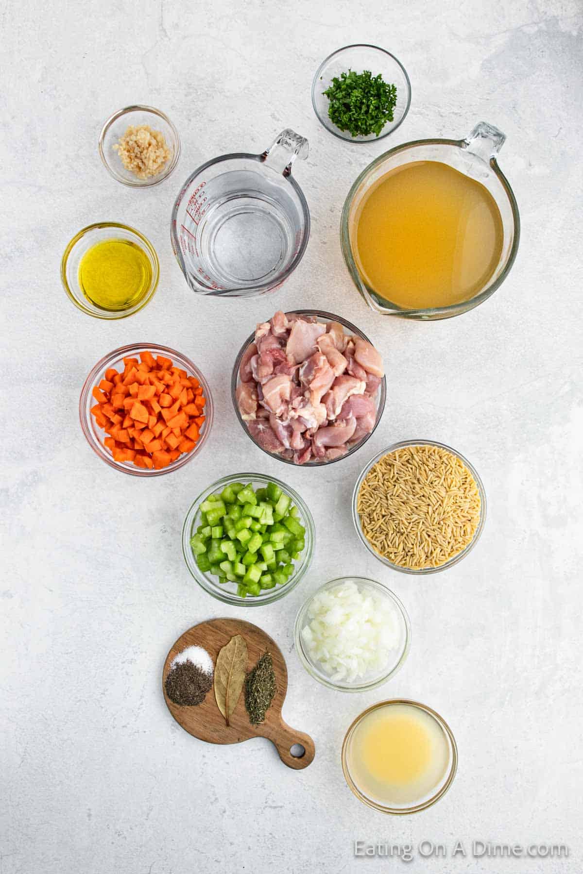 Ingredients - Chicken Thighs, olive oil, minced garlic, onion, carrots, celery, thyme, pepper, salt, bay leaf, lemons, Orzo, Broth, Parsley