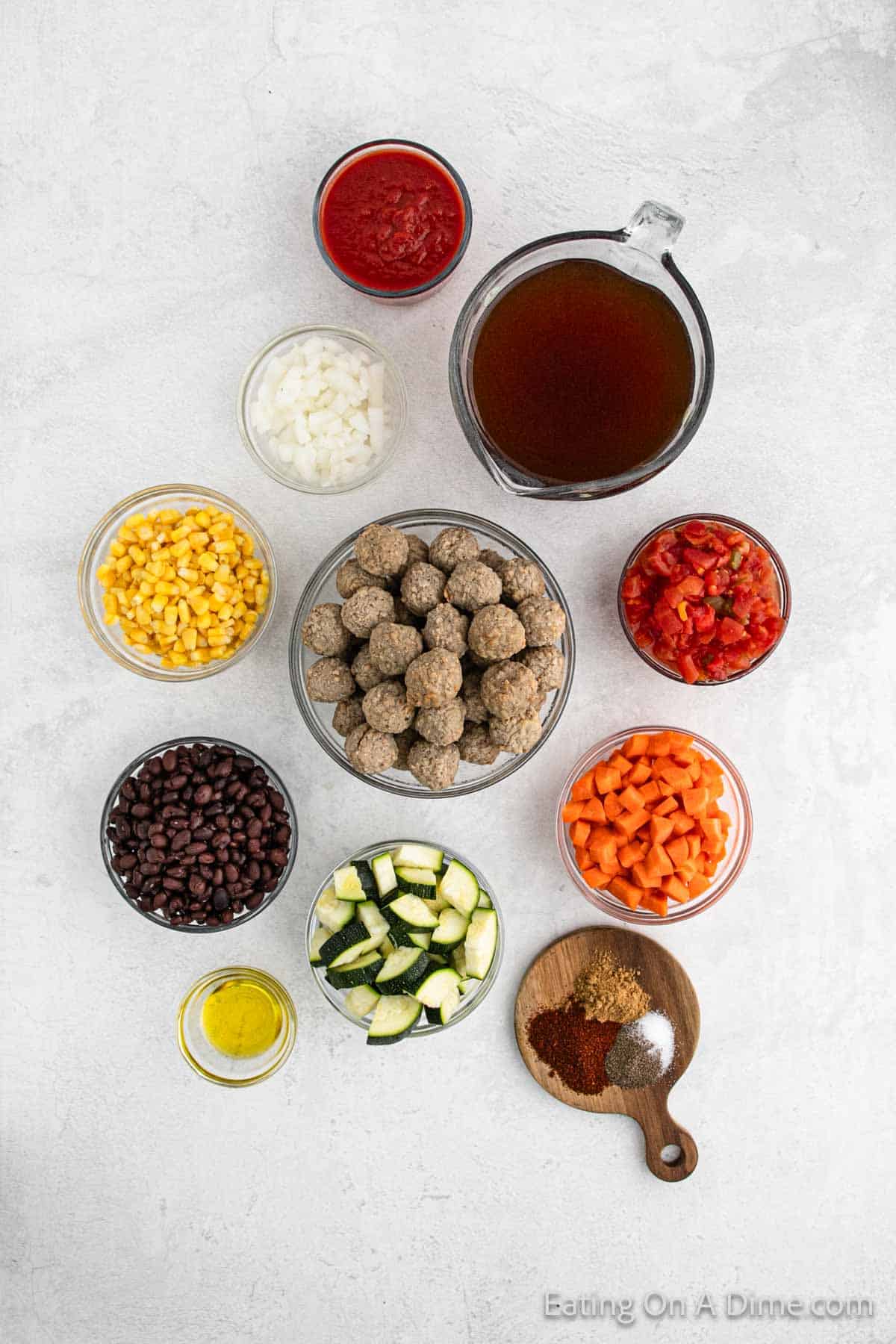 Ingredients - Frozen Meatballs, diced tomatoes, tomato sauce, beef broth, onion, olive oil, carrots, zucchini, black beans, frozen corn, salt, pepper, chili powder, cumin, cilantro