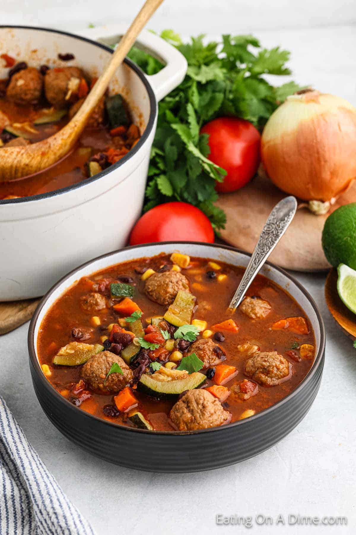 Meatball Soup in a bowl with black beans, and veggies