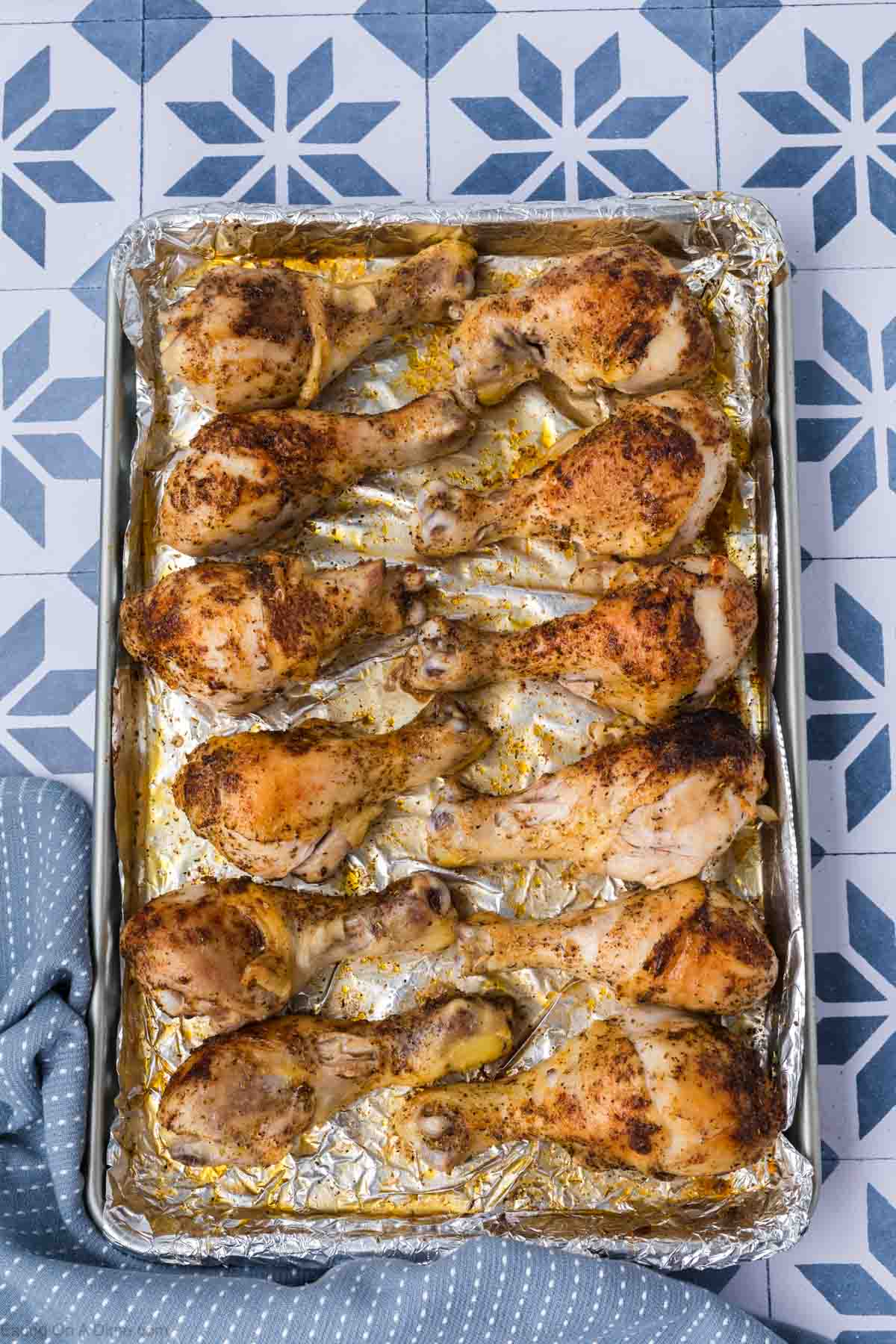 baked chicken legs on a baking sheet