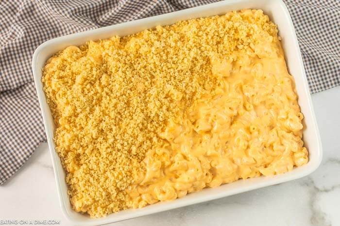 Close up image of Baked Mac and cheese in the process of topping being put on. 