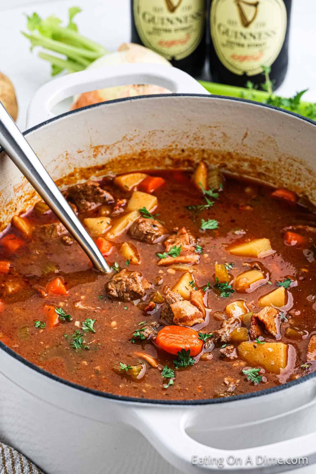 Large pot of Irish Beef Stew with a silver spoon