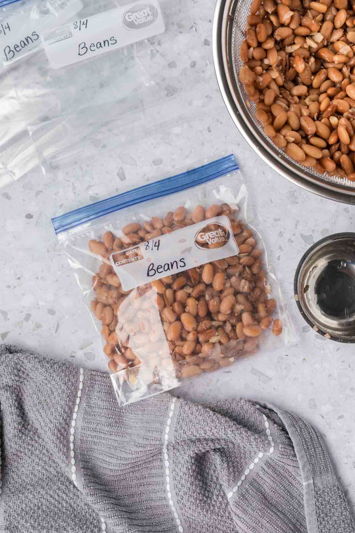 Cooked beans in a labeled zip lock freezer bag 