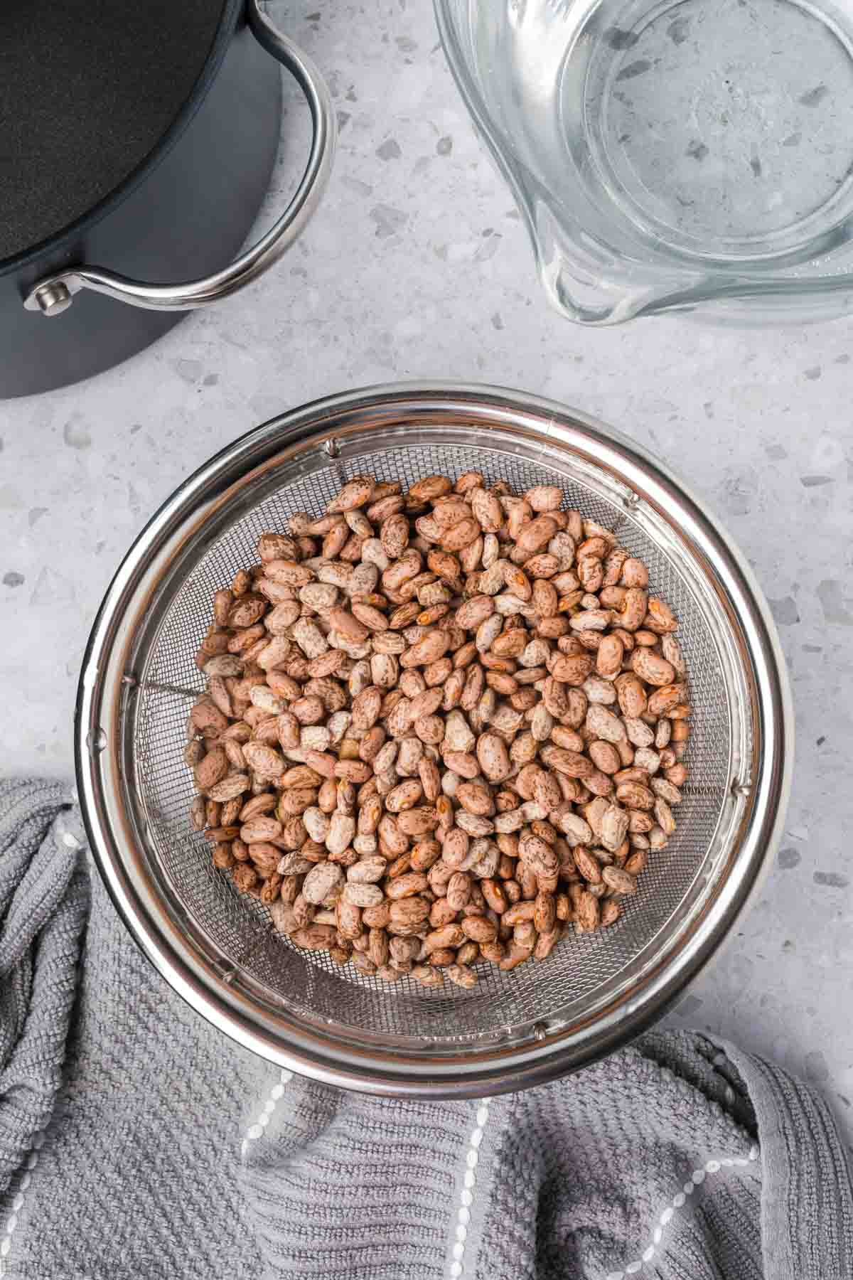 Uncooked Beans in a colander