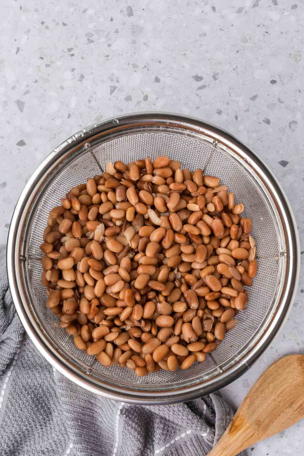 Cooked beans in a colander