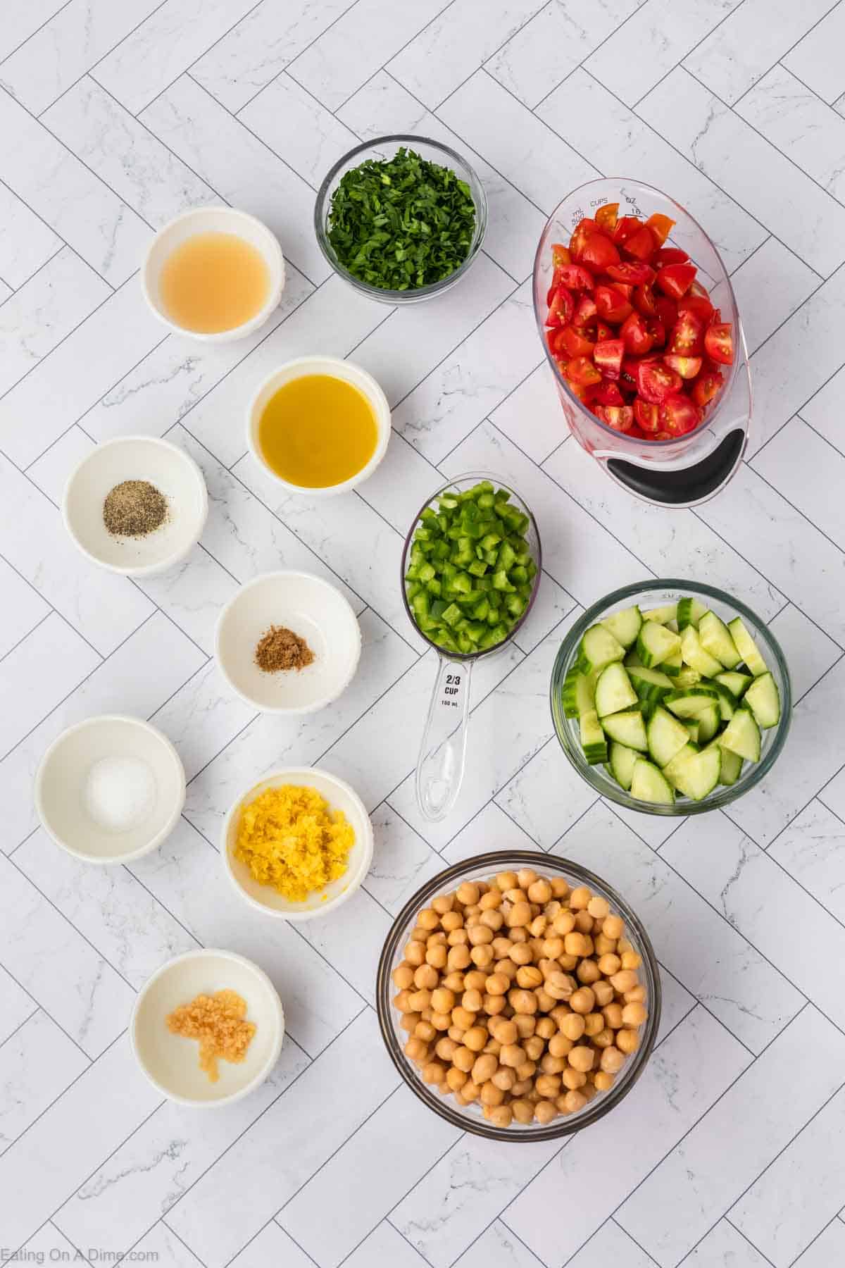 Ingredients - Chickpeas, parsley, cucumber, grape tomatoes, bell pepper, olive oil, garlic minced, lemon juice, lemon, cumin, salt, pepper