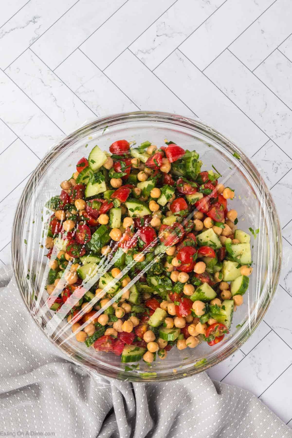 Combine the dressing ingredients in with the chickpea salad ingredients covered in a bowl