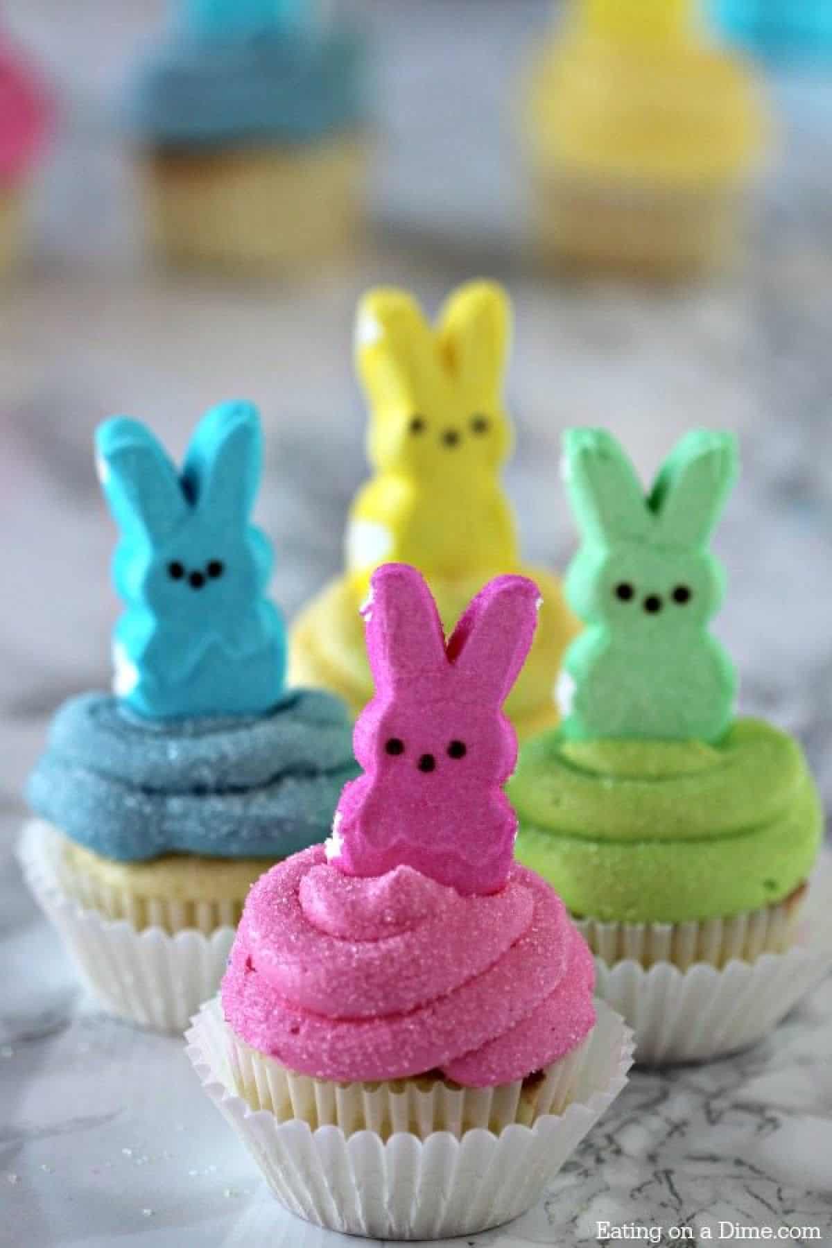 These Peeps Cupcakes are adorable. Easy Easter Cupcakes to make in minutes. Peeps cupcakes are now our favorite Easter Dessert Recipe. They are fun and the kids loved these cupcakes with peeps. #eatingonadime #Eastercupcakes #Easterdessertsideas