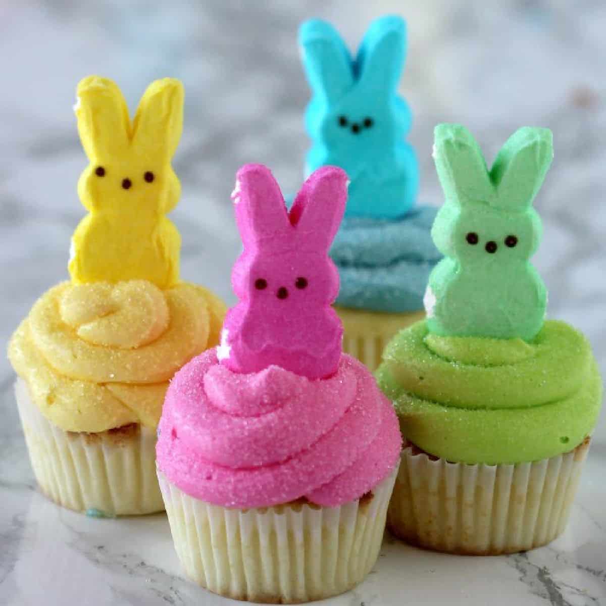 These Peeps Cupcakes are adorable. Easy Easter Cupcakes to make in minutes. Peeps cupcakes are now our favorite Easter Dessert Recipe. They are fun and the kids loved these cupcakes with peeps. #eatingonadime #Eastercupcakes #Easterdessertsideas