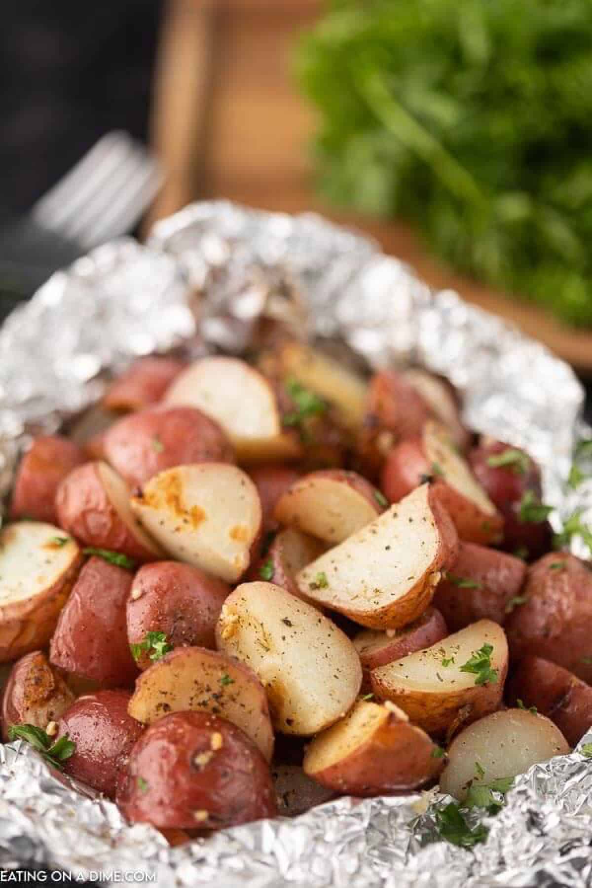 Foil pack grilled red potatoes help to make dinner a breeze without any cleanup. This is the perfect side dish for the grill or the oven. 