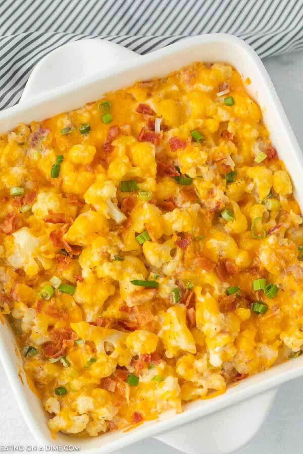 Keto loaded cauliflower is so delicious that you won't even miss the carbs. Each bite has lots of cheese, sour cream, bacon and more. 