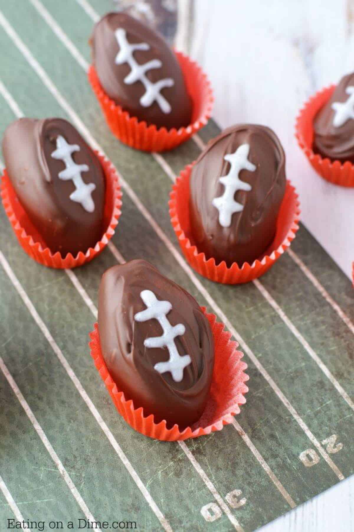 Enjoy these Football Shaped Chocolate Peanut Butter Balls that are perfect for the big game! Creamy and delicious and oh so cute! Get all the tips here. 