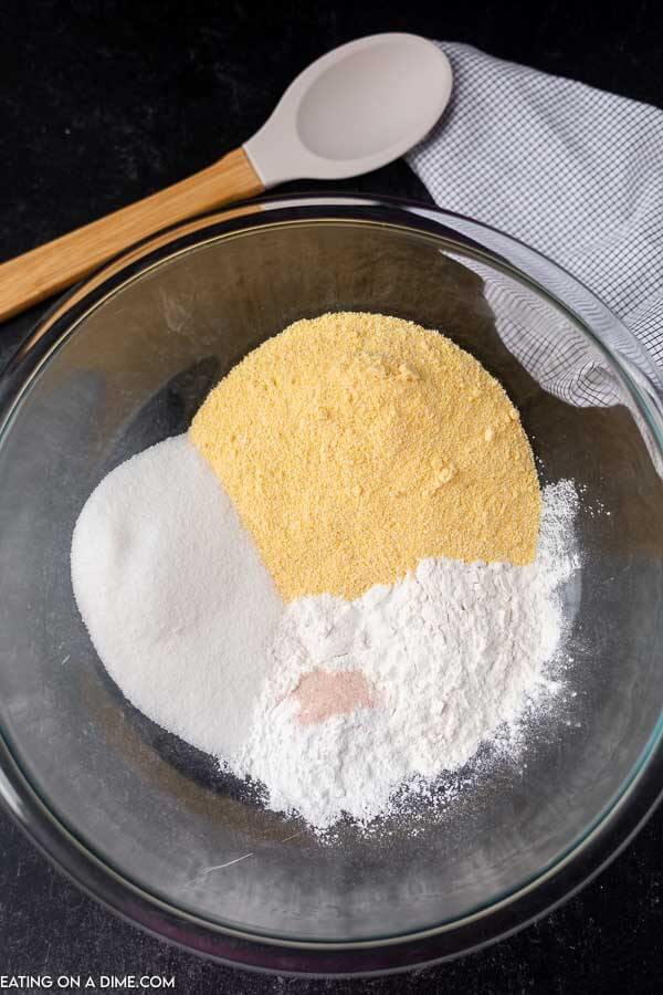 Flour, sugar, cornmeal, salt, and baking powder in a bowl