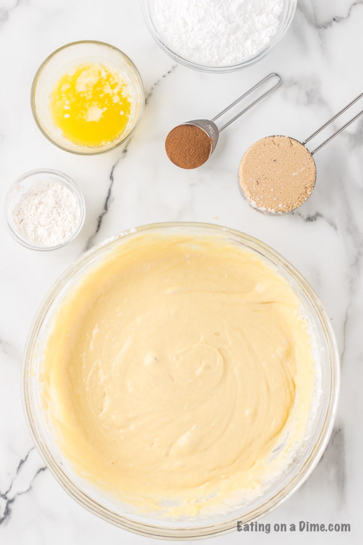 The batter for the cake mixed together in a large mixing bowl.  