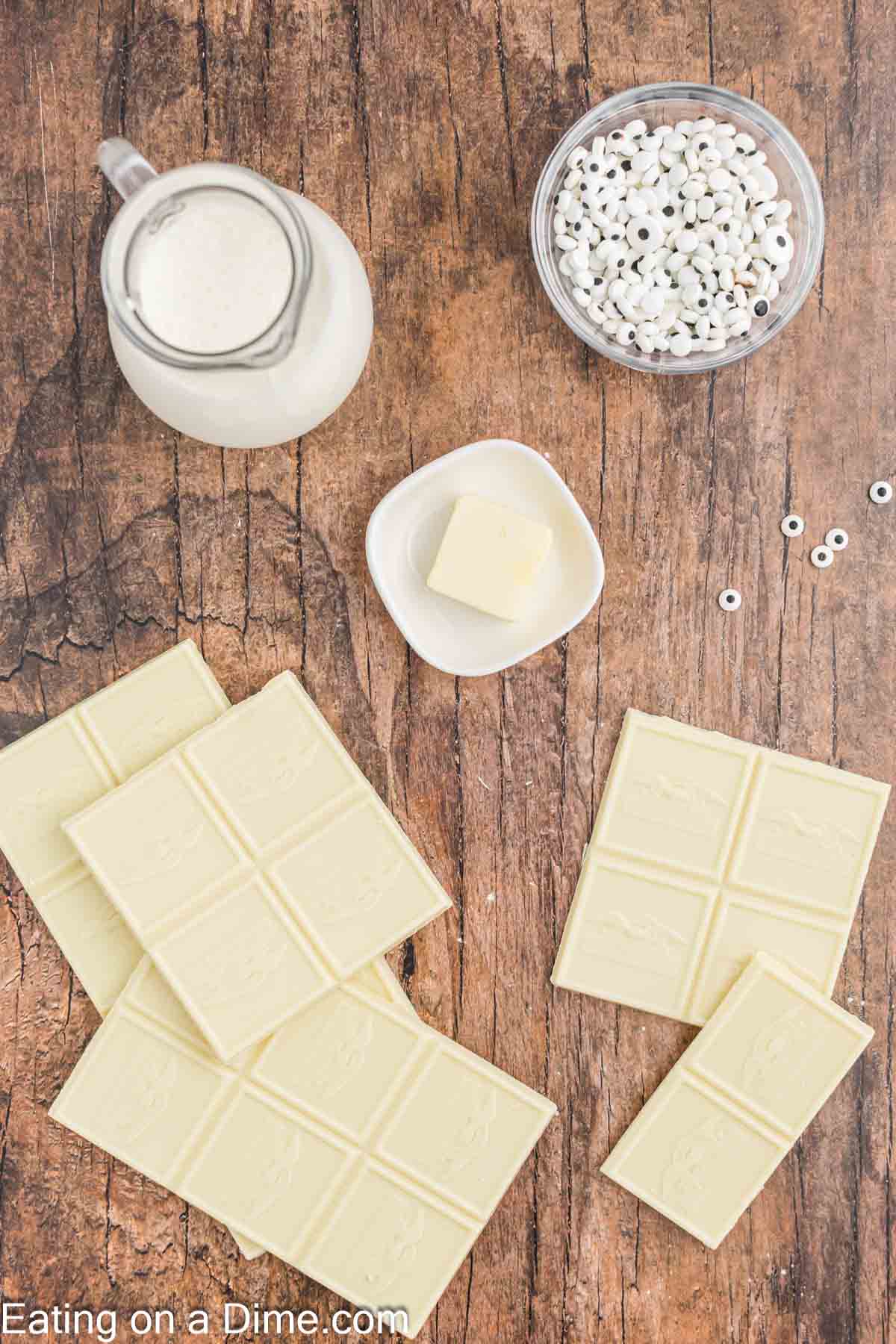 Ingredients - White Chocolate baking bars, heavy whipping cream, butter, candy eyes, white jimmies