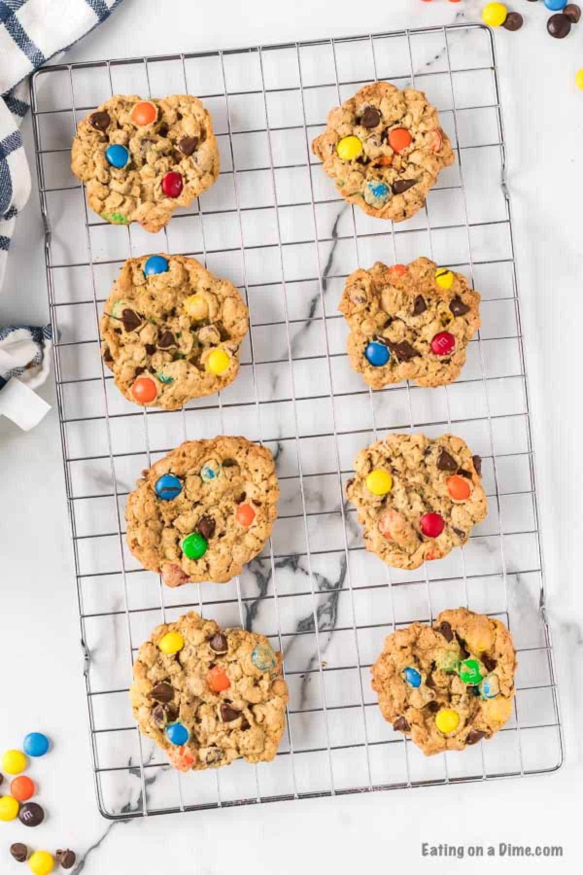 Monster cookies on a cooling rack. 