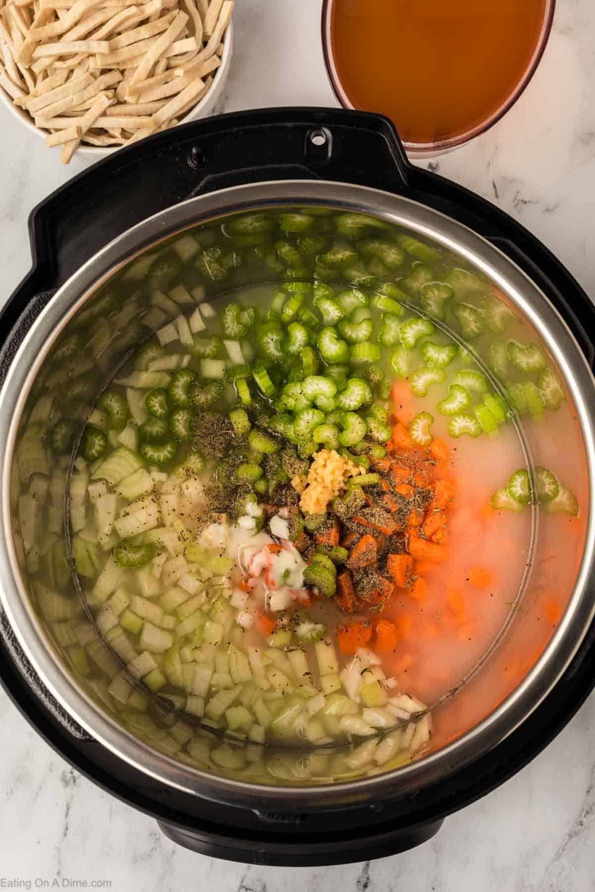 Chopped celery, carrots, and onions with seasoning with the flour mixture mixed in