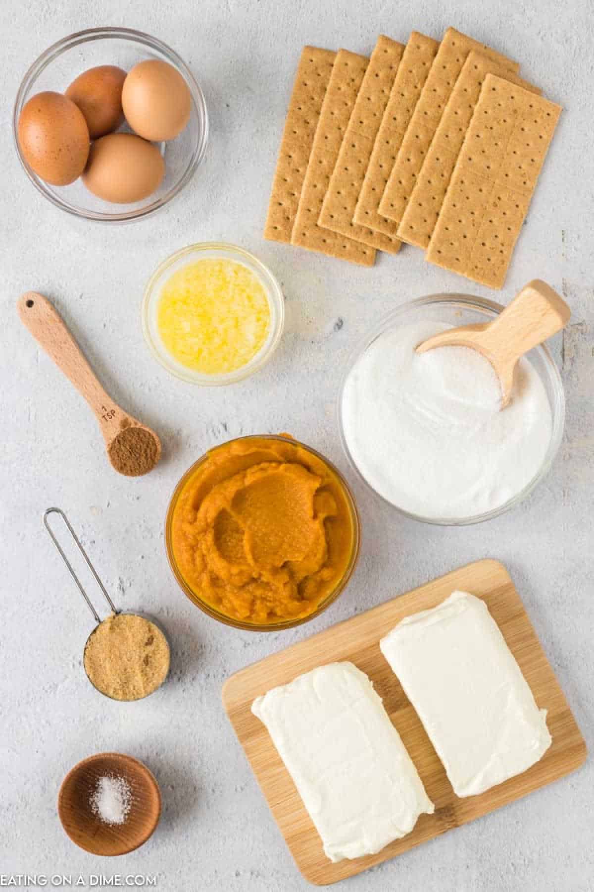 Ingredients - Graham Cracker Crushed, brown sugar, butter, salt, cream cheese, sugar, eggs, pumpkin puree, pumpkin pie spice, whipped cream