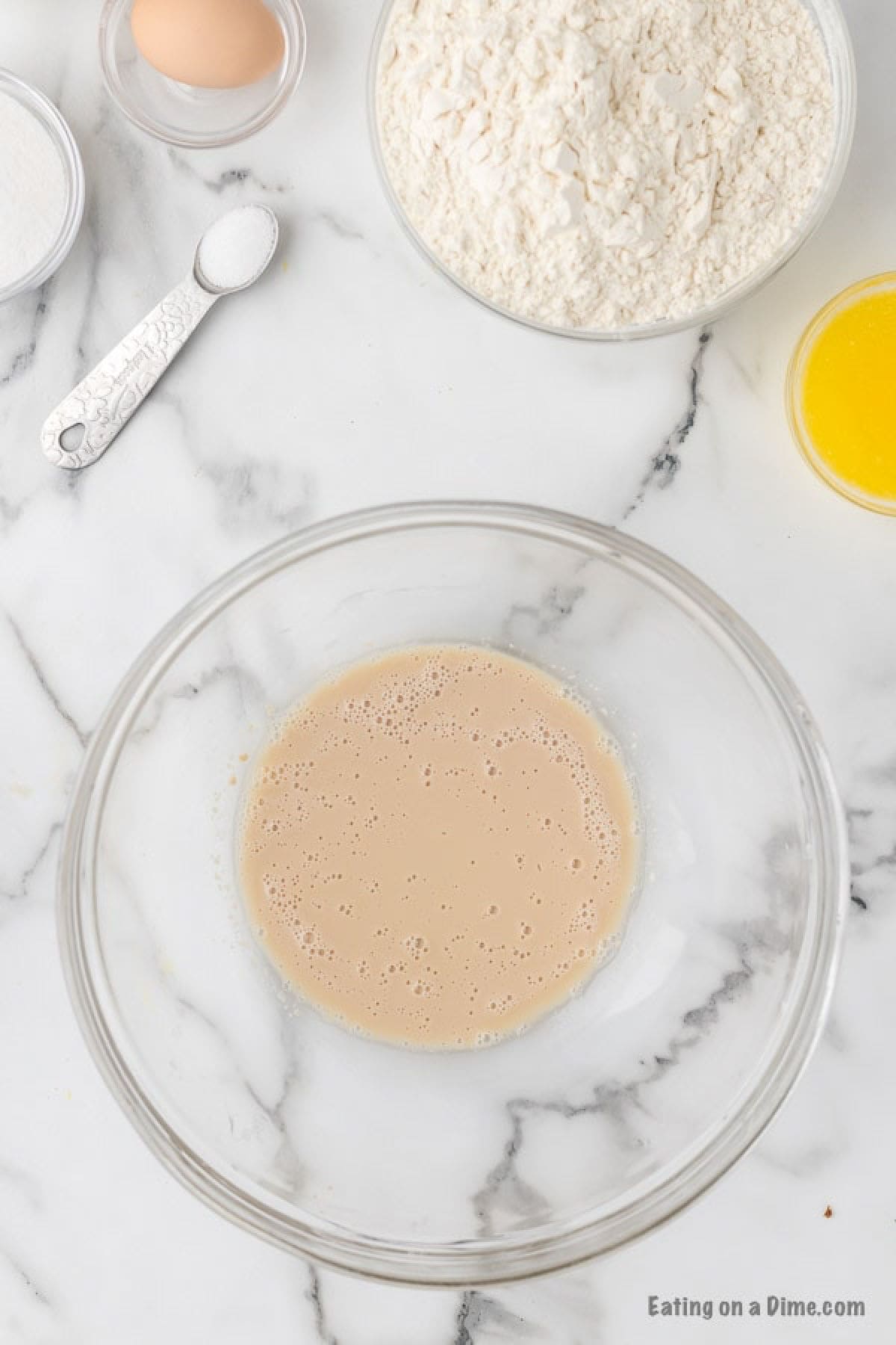 Place water and yeast in bowl and mix together