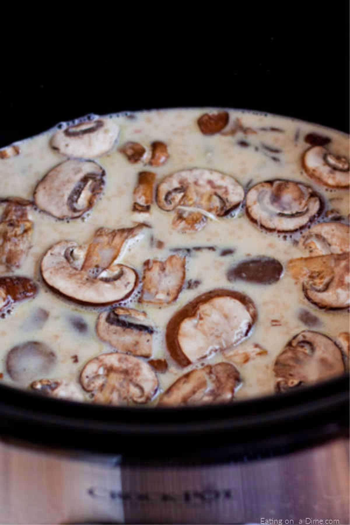 crock pot of mushrooms and sauce